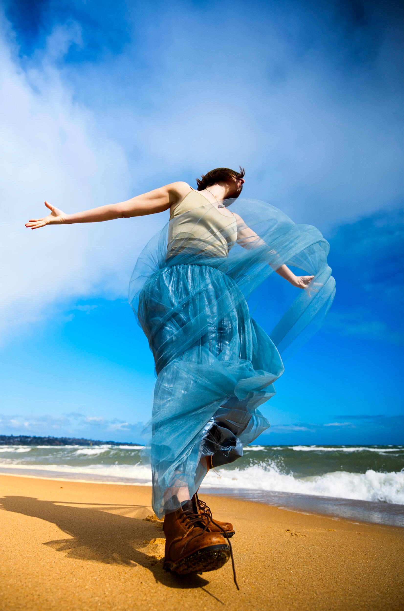 Colourful Inner Child at the Beach This is one of my more creative, fashion inspired portraits. A woman prancing a child like persona on a beach in Frankston, Victoria
