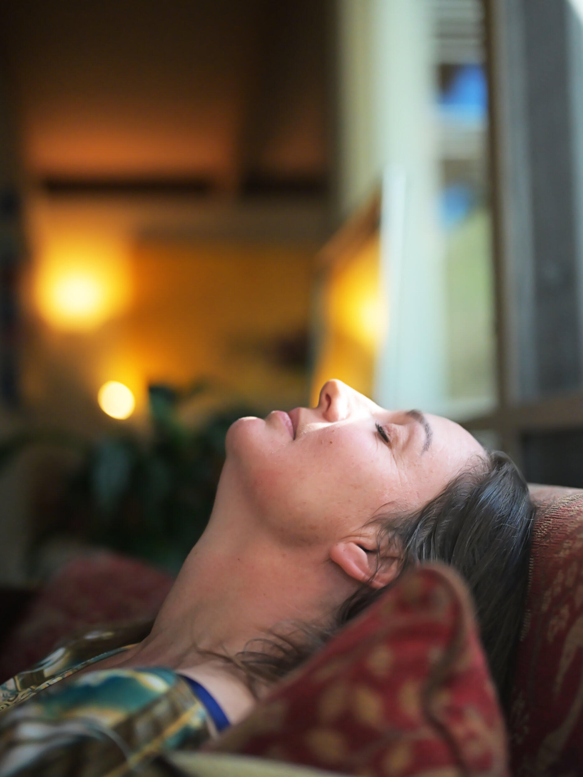 A resting head on the couch This portrait was captured at her home in Glen Iris, Victoria. I loved the background lighting and the sun through the window while she rested her head on the couch in meditation