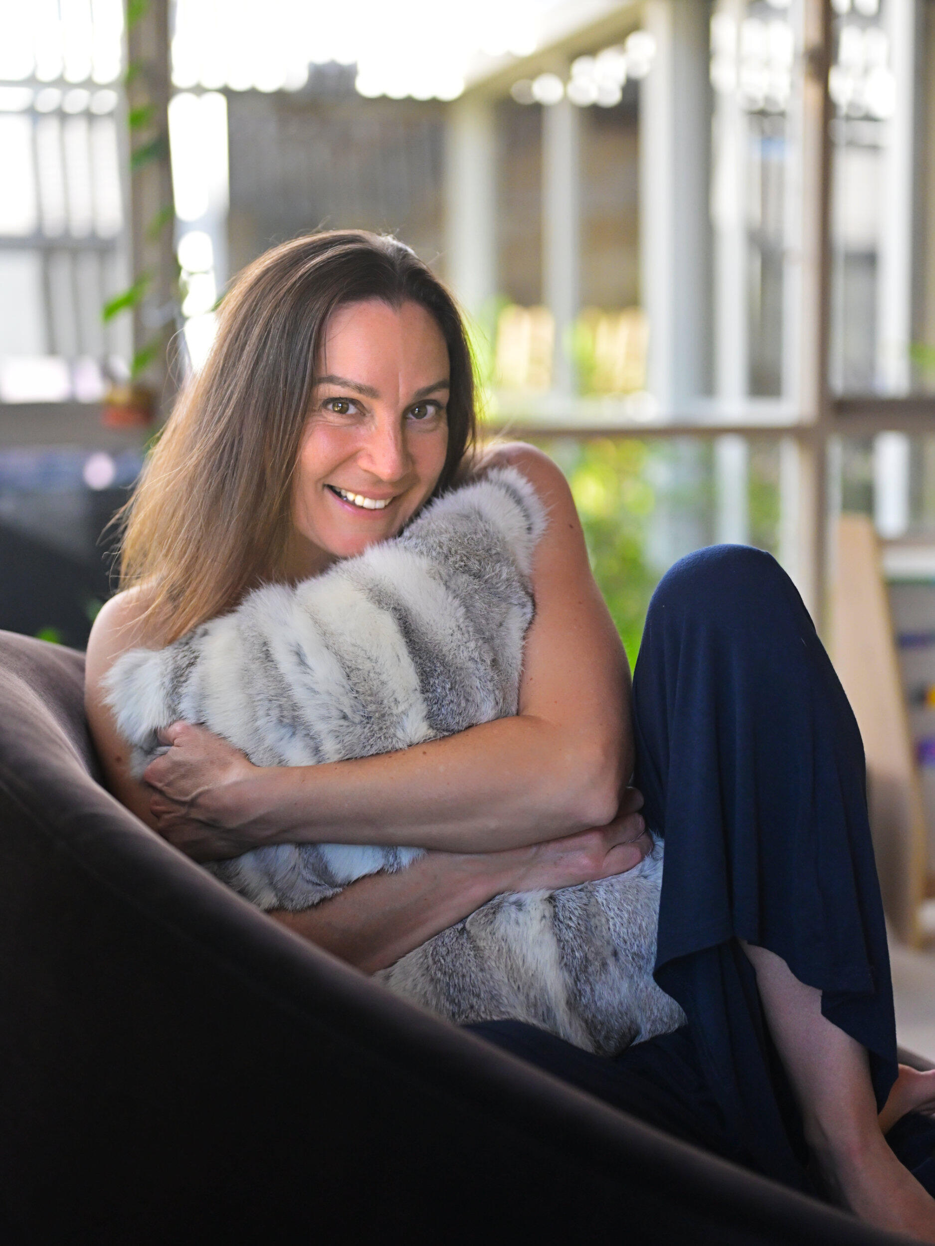 Cosy Life Coach Vibes This is such a beautiful naturally lit portrait. She looks so soft and comfortable. A portrait of a hug.