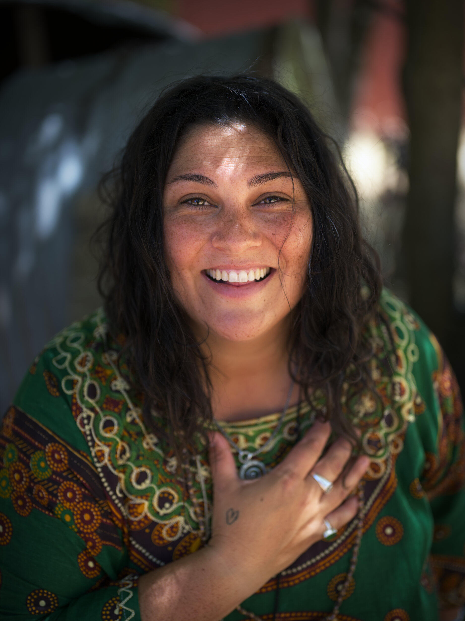 A smiling spirited human A colourful portrait of a spirited woman with her hand on her heart in Mount Eliza, Victoria