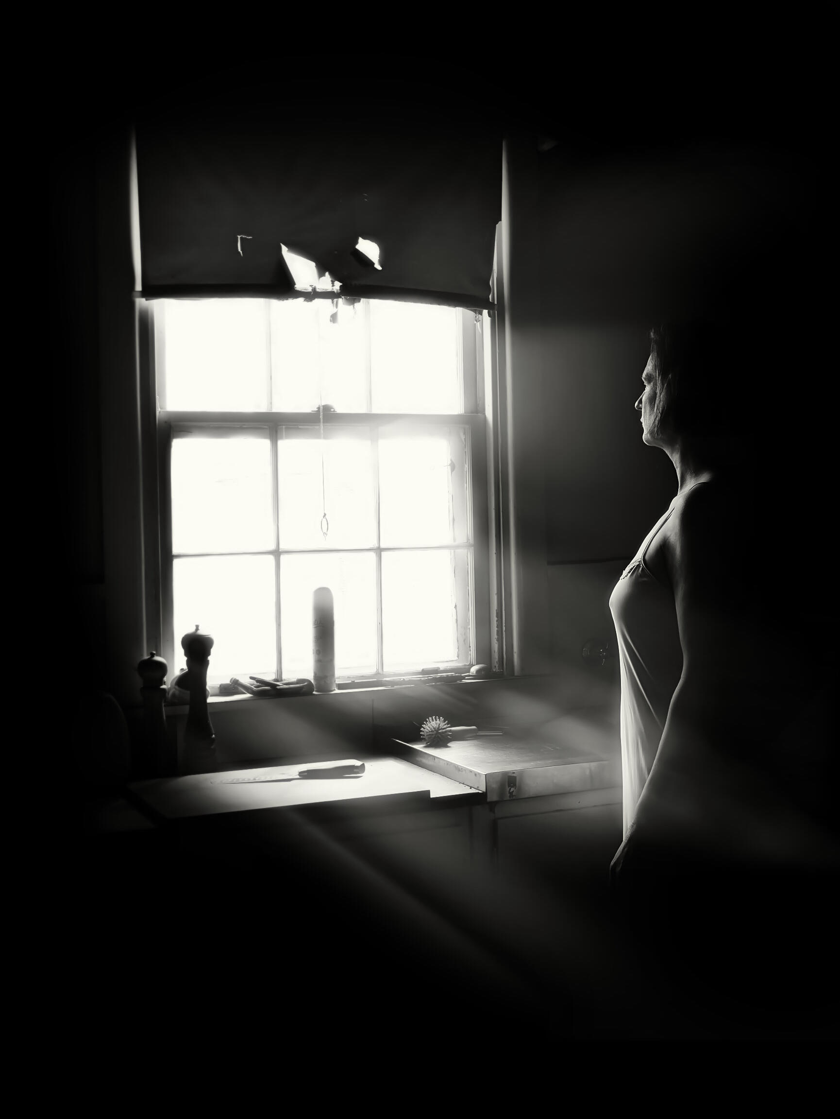 Found In Light Black and white portrait of a woman lit by window light during a Found In Light photography session in Mount Eliza, Victoria.