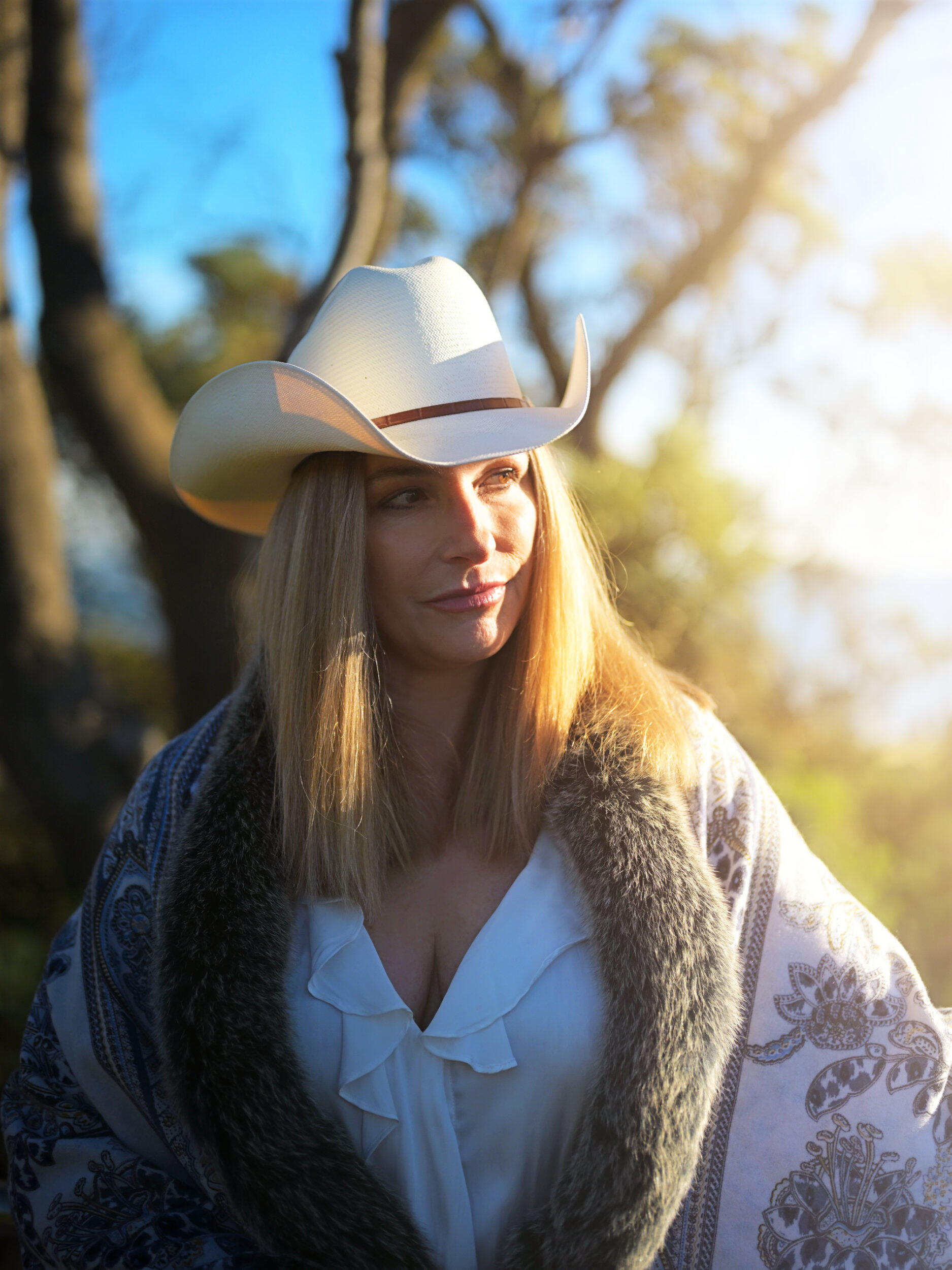 Cow Girl Sunset Portrait Shot at Frankston beach just before sunset. She wears a cowboy hat enjoying the warm sun in a Melbourne winter