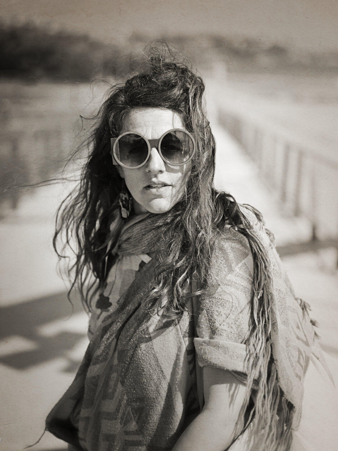 Captured on the Frankston foreshore bridge, I brought a bit of a dystopian vibe to her usual funky attire. The black and white sepia feel really brings it to this portrait